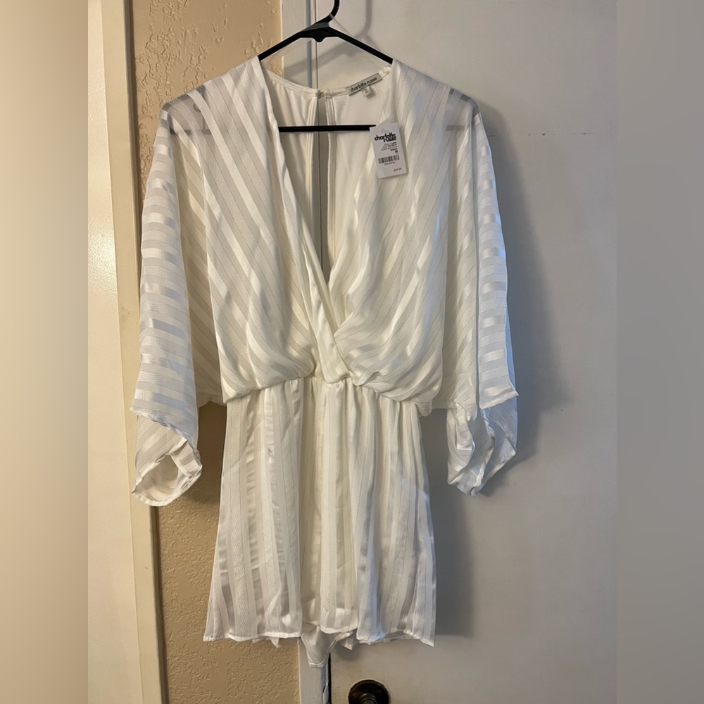 Women’s Ivory/White Romper New Never Worn. Deep V neck. Good condition